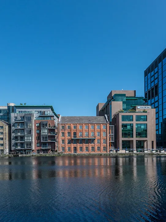 A view of a group of buildings across the water.