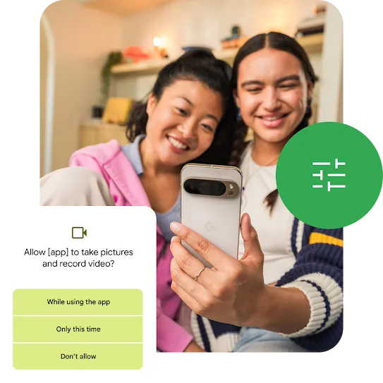 A user is taking a selfie along with their friend using an Android smartphone. And Android is prompting the user to select the level of access they want to give the app to take pictures and record videos.