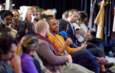 A man is holding mic in his hand.