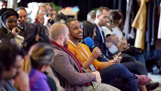 A man is holding mic in his hand.