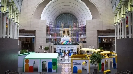 atrium hall with demo booths and mission district