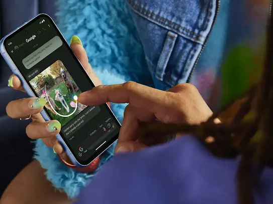 Woman holding Android phone using Circle to Search feature