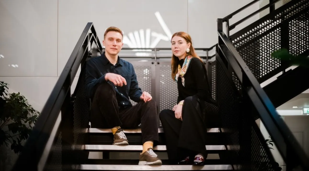 two people setting on stair