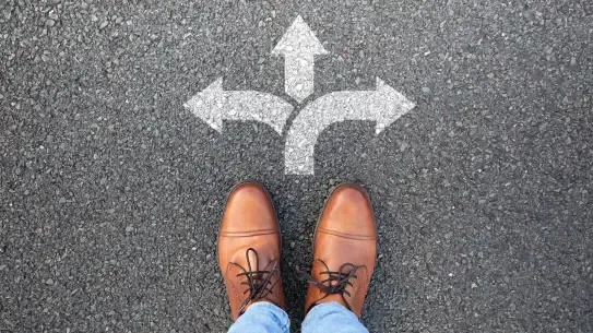 two shoes facing a chalk arrow