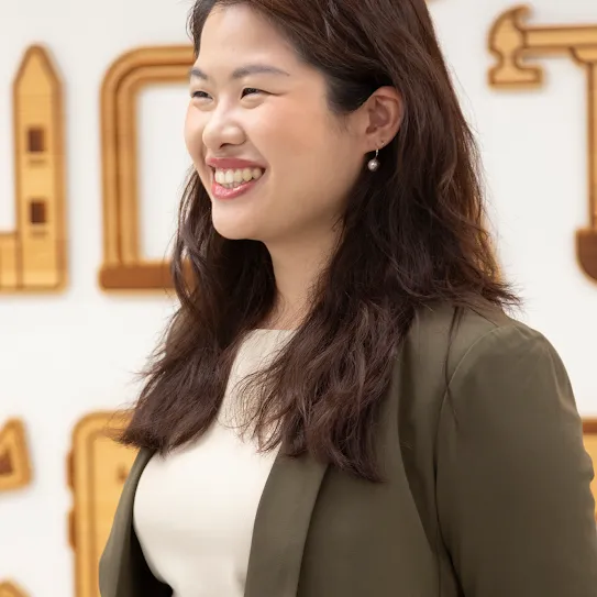 Rachel Huang from Junyi Academy standing and smiling in Taipei Taiwan