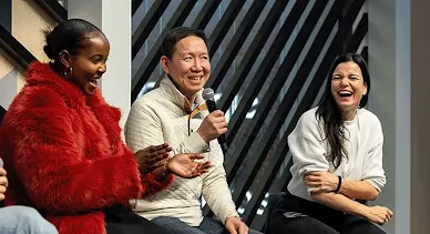 A person from the group is addressing the others with a mic.