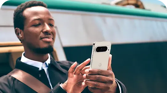 Image of a man scrolling through his Google pixel phone.