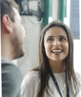 Woman smiling and facing the camera.