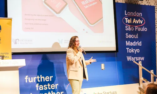 a lady holding mic and giving speech 