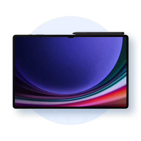 A black tablet with a  pen resting on top. Its screen shows an abstract colorful image.