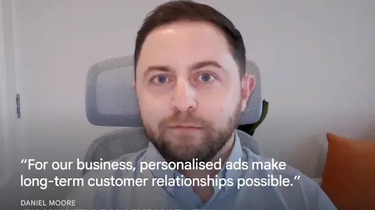 A headshot of Daniel Moore, Head of Marketing, E-commerce & Digital at The AA, sitting in an office chair. Overlaid on the image is a white text quote: "For our business, personalised ads make long-term customer relationships possible." His name and professional title are displayed at the bottom-left.