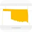 An illustration of a laptop screen displaying a map with the state of Oklahoma highlighted in bright yellow.