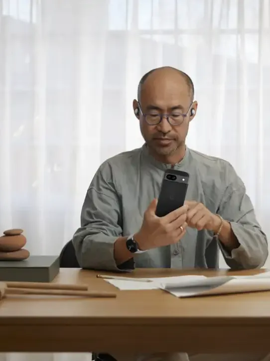 Image of a man using his Android-powered device