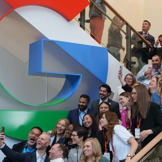Teachers take a picture in front of a Google G at the 2026 National Teachers of the Year
