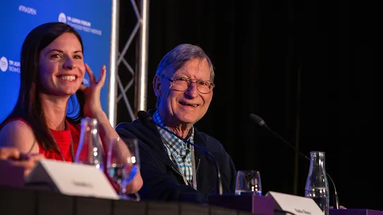 Cisco’s Katie Shay and Google’s Hal Varian smiling while seated on a panel at the TPI Aspen Forum.