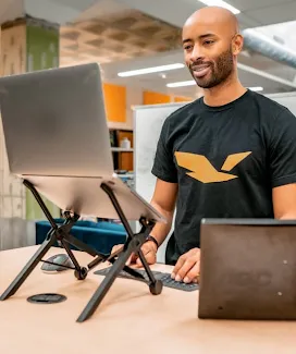 Woman chatting with a man, smiling.