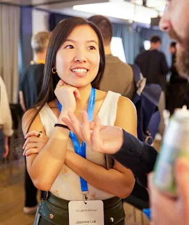 A woman wears an id card