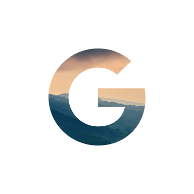 letter G filled with mountains and sky 