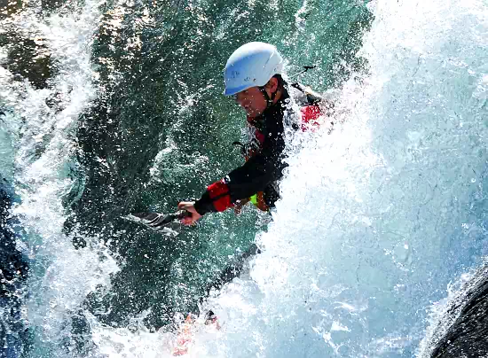 Image: .png image of man kayaking in rapids.